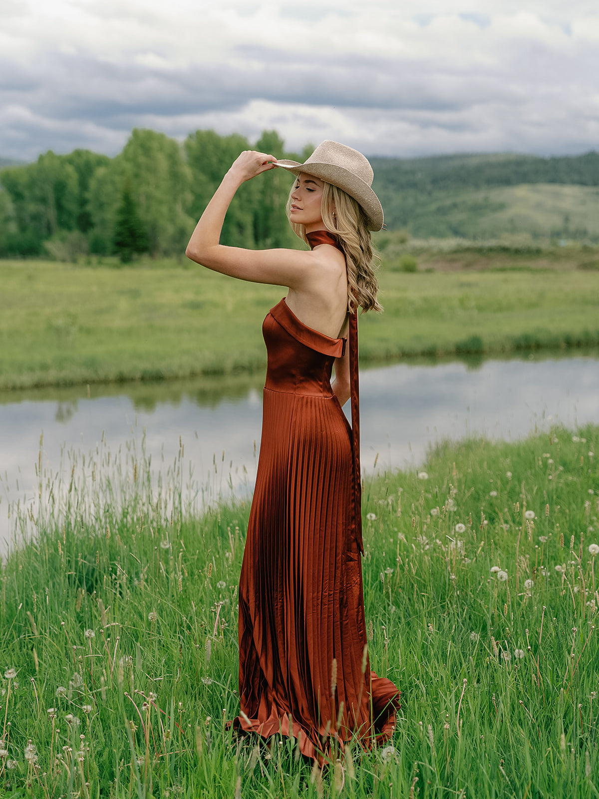 Color: Rust; Pictured with the Saylor Satin Pleated Dress