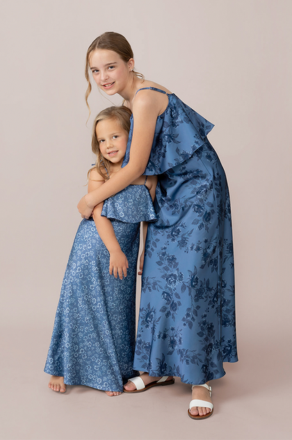Model: Elise; Size: J12; Color: Indie Blue Bouquet, pictured with the Kids Riley in Dusty Blue Posey Satin