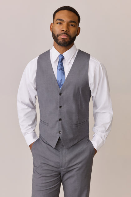 Color: Indie Blue Bouquet, Pictured with Gray Vest and Pants