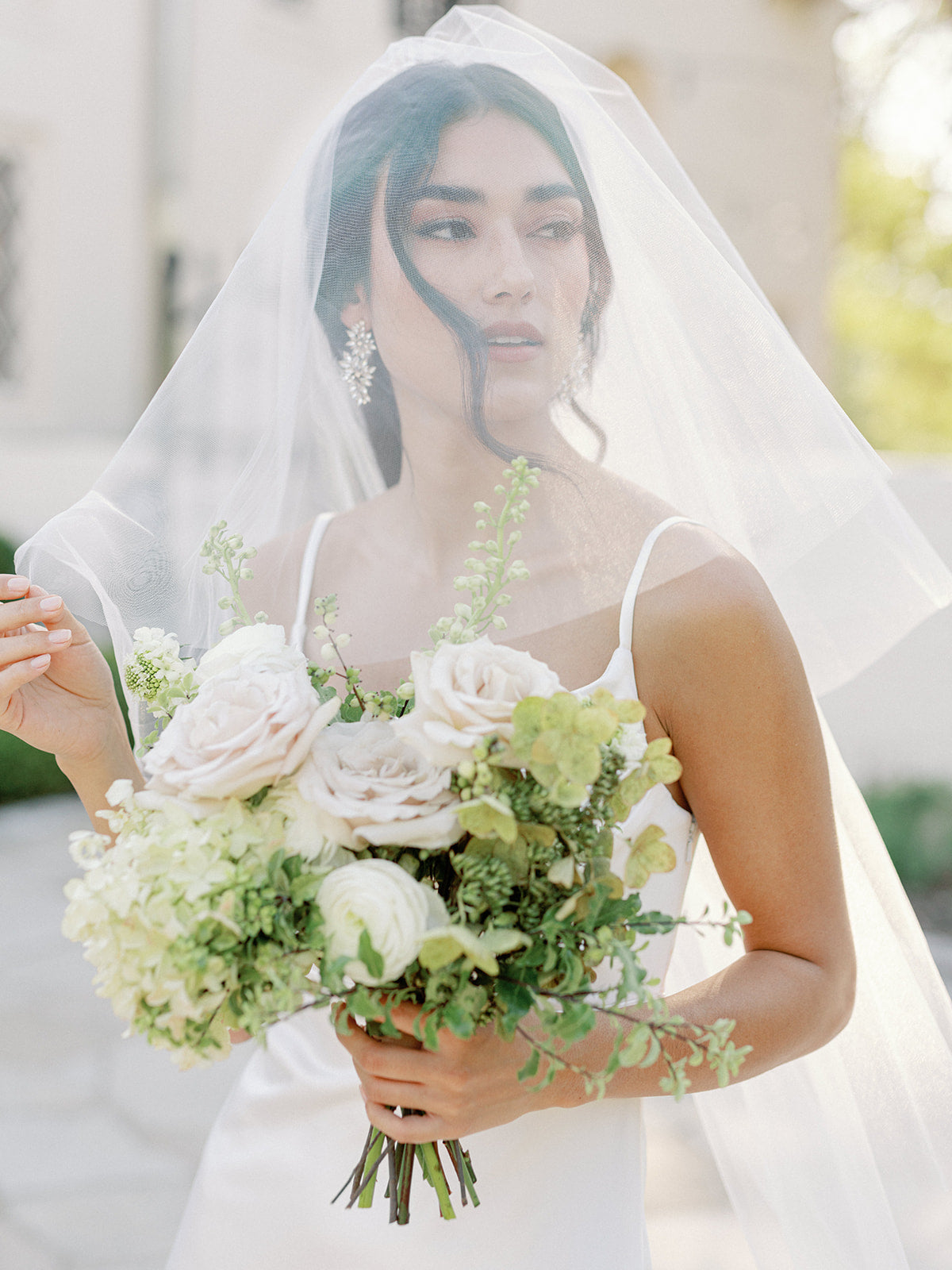 https://shoprevelry.com/cdn/shop/products/classic-tulle-veil_lifestyle_main-hover.jpg?v=1675960310